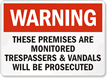 Warning These Premises Are Monitored Sign