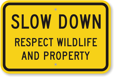 Sign reading: Slow down. Respect wildlife and property