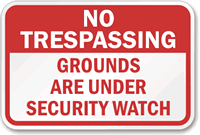 No Trespassing Grounds under Security Watch Sign
